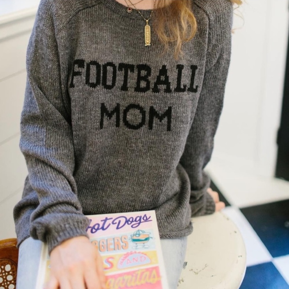 Wooden Ships by Paola Buendia Football Mom Sweater